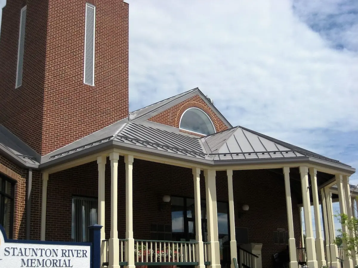 Skilled roofing craftsmen working on a residential roof in College Heights